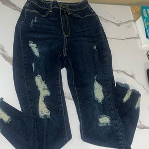 High-rise dark blue jeans, stretchy